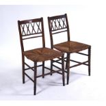 A PAIR OF REGENCY LATTICE BACK SIDE CHAIRS