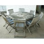 A HARDWOOD OCTAGONAL GARDEN TABLE WITH LATTICE FRIEZE