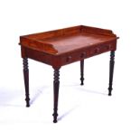 A REGENCY MAHOGANY GALLERIED TWO DRAWER WRITING TABLE