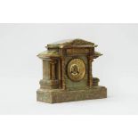 A FRENCH ONYX AND GILT-METAL MOUNTED MANTEL CLOCK