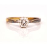 AN 18CT GOLD AND DIAMOND SINGLE STONE RING