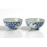 A PAIR OF CHINESE BLUE AND WHITE `THREE FRIENDS' BOWLS