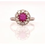 A PLATINUM, RUBY AND DIAMOND CLUSTER RING