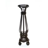 A WROUGHT IRON JARDINIERE STAND