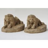 A PAIR OF RECONSTITUTED STONE LIONS