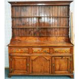 A GEORGE II SOLID YEW-WOOD DRESSER