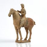 A CHINESE POTTERY EQUESTRIAN FIGURE