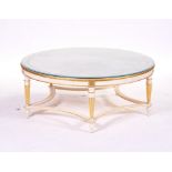 A MODERN CREAM AND GOLD CIRCULAR COFFEE TABLE