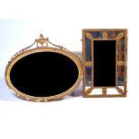 AN EARLY 20TH CENTURY GILT FRAMED OVAL MIRROR