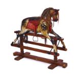 A PAINTED WOODEN ROCKING HORSE
