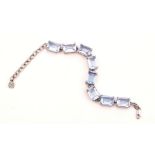 A SILVER AND PALE BLUE TOPAZ BRACELET