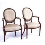 A PAIR OF HEPPLEWHITE MAHOGANY FRAMED OPEN ARMCHAIRS