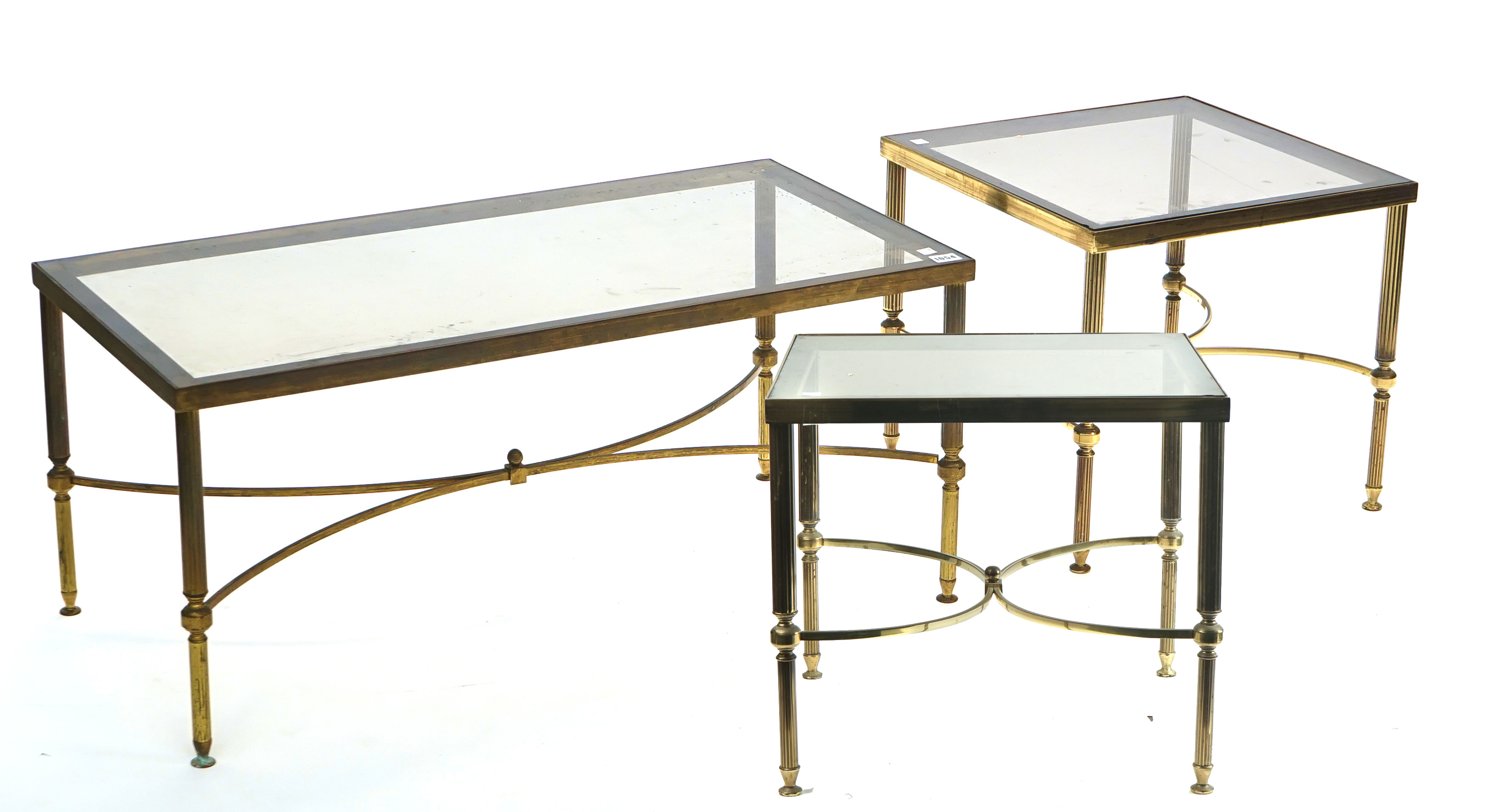 A SUITE OF THREE MID-20TH CENTURY LACQUERED BRASS AND SMOKED GLASS COFFEE TABLES