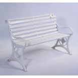 A 19TH CENTURY WHITE PAINTED CAST IRON GARDEN BENCH