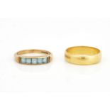 A 18CT GOLD WEDDING RING AND ANOTHER RING (2)