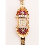 A GOLD, RUBY AND DIAMOND DRESS COCKTAIL WATCH