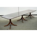 A GEORGE III MAHOGANY TRIPLE PILLAR DINING TABLE