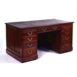 A 20TH CENTURY MAHOGANY PEDESTAL DESK