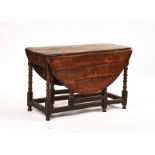 A CHARLES II JOINED FRUITWOOD GATELEG DINING TABLE
