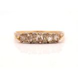 A GOLD AND DIAMOND SET FIVE STONE RING