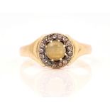 A GOLD, CHRYSOBERYL CAT'S EYE AND DIAMOND CLUSTER RING
