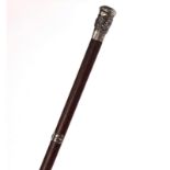 A BURMESE OR INDIAN SILVER MOUNTED HARDWOOD WALKING CANE