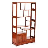 A 20TH CENTURY CHINESE HARDWOOD MULTI-TIERED DISPLAY CABINET