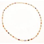 A GOLD, VARICOLOURED SAPPHIRE AND RUBY NECKLACE