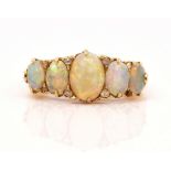 A GOLD, OPAL AND DIAMOND RING