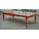 A MID-19TH CENTURY MAHOGANY EXTENDING DINING TABLE