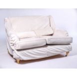 A MODERN TWO SEATER SOFA