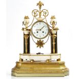 A FRENCH GILT-METAL AND WHITE MARBLE MANTEL CLOCK