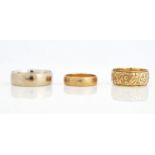 THREE 9CT GOLD WEDDING RINGS (3)