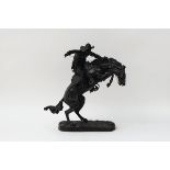 A BRONZE SCULPTURE 'THE BRONCHO BUSTER'