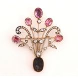 A VICTORIAN DIAMOND AND FOIL BACKED VARIOUS PINK GEMSTONE SET BROOCH