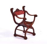 A 19TH CENTURY ITALIAN WALNUT SAVONAROLA CHAIR