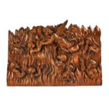 A NORTH ITALIAN CARVED PINE PANEL DEPICTING SOULS BEING PLUCKED FROM PURGATORY BY AN ANGEL