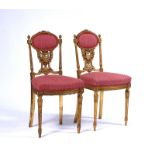 A PAIR OF LATE 19TH CENTURY FRENCH GILT FRAMED SIDE CHAIRS