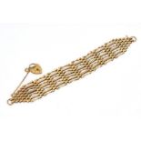 A 9CT GOLD GATELINK BRACELET