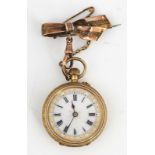 A GOLD, DIAMOND SET AND ENAMELLED LADY'S FOB WATCH AND BROOCH (2)