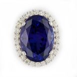 A WHITE GOLD, TANZANITE AND DIAMOND OVAL PENDANT