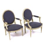 A PAIR OF GREEN PAINTED LOUIS XVI STYLE OPEN ARMCHAIRS