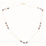 A GOLD AND SAPPHIRE NECKLACE