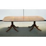 A MAHOGANY D-END EXTENDING DINING TABLE