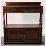 A late 19th century mahogany two tier side cupboard