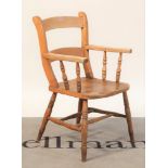 An early 20th century beech and elm scullery open armchair