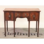 A George III mahogany serpentine sideboard