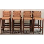 A set of eight modern oak and rope bar stools