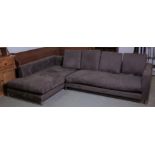 A modern grey upholstered corner sofa