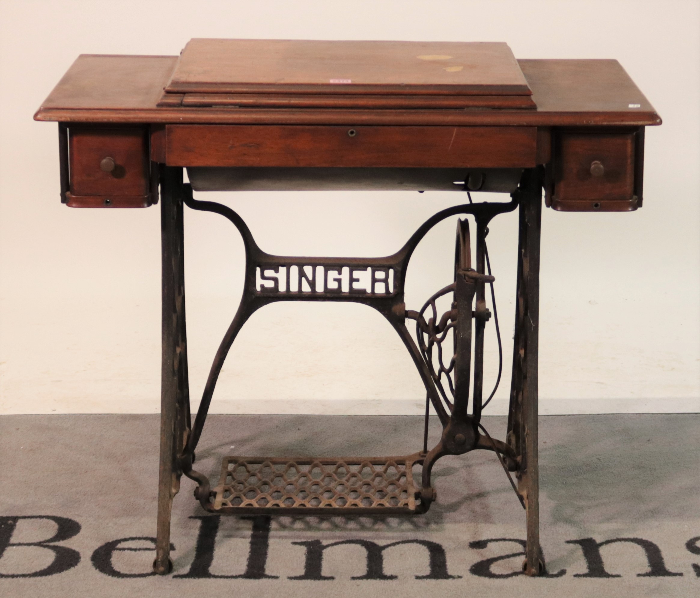 ‘Singer’ an early 20th century treadle powered sewing table